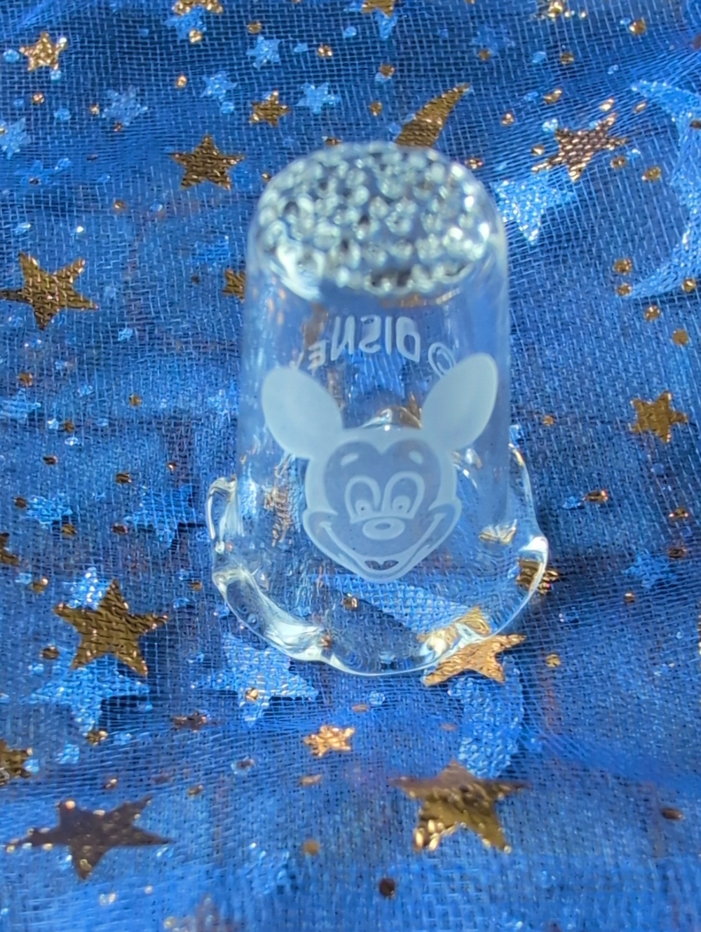 Clear glass Disney thimble featuring an etched Mickey Mouse and a ruffled rim